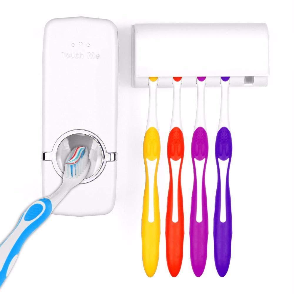 The Wukusy 174 Toothpaste Dispenser and Tooth Brush Holder is wall-mounted, with four colorful toothbrushes—yellow, red, orange, and purple—hanging beside it. A blue-and-white toothbrush is being inserted into the dispenser.